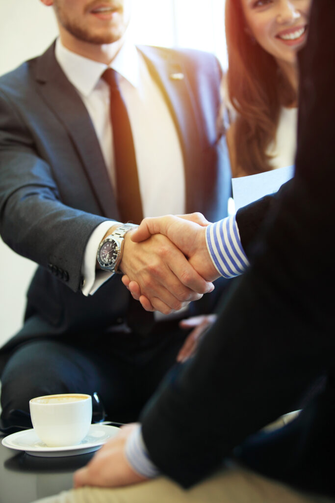 Business people shaking hands, finishing up a meeting